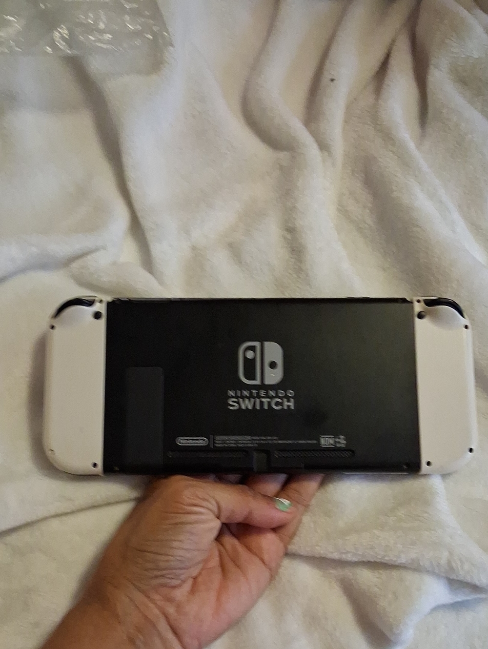 Nintendo Switch OLED — Black Console with White Joy-Con